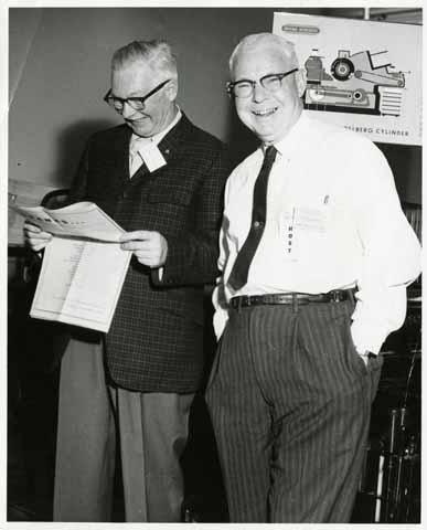 [Printing Department head Bert Fellows and unidentified man at event]