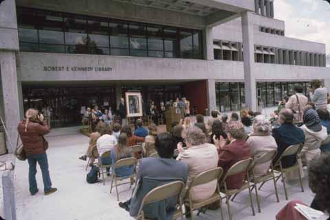 [Crowd sitting in front of the completed Kennedy Library]