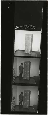 Wally Glidden standing next to boxes