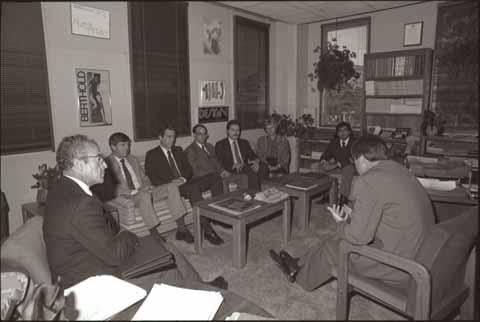 President Warren J. Baker and group meeting in Baker's office