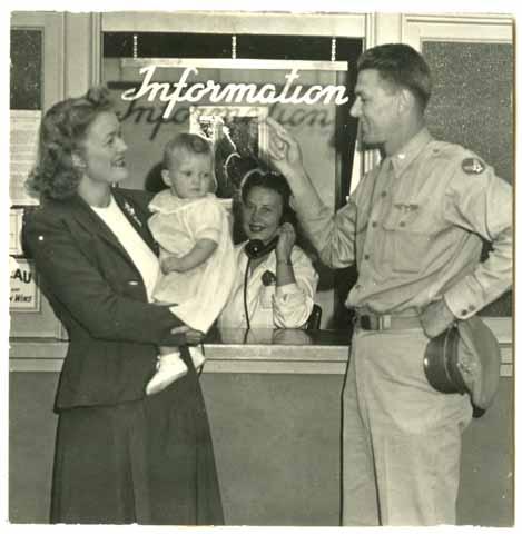 Major Gus Gibson with His Wife and Child as he Signs Up for Classes