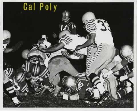 Cal Poly [running back lunging over the defensive line]