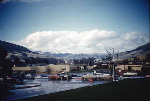 [View of snow on campus and distant snow capped hills]