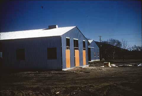 [Right side of shop building before snowfall, 1962]