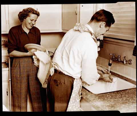 [Two people washing dishes]
