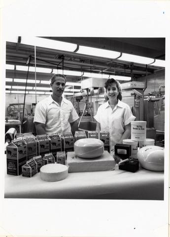 [Two students display Cal Poly dairy products]