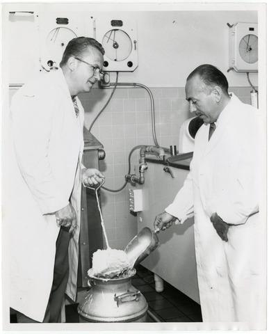 [Gus Beck demonstrates the ice cream churning process]